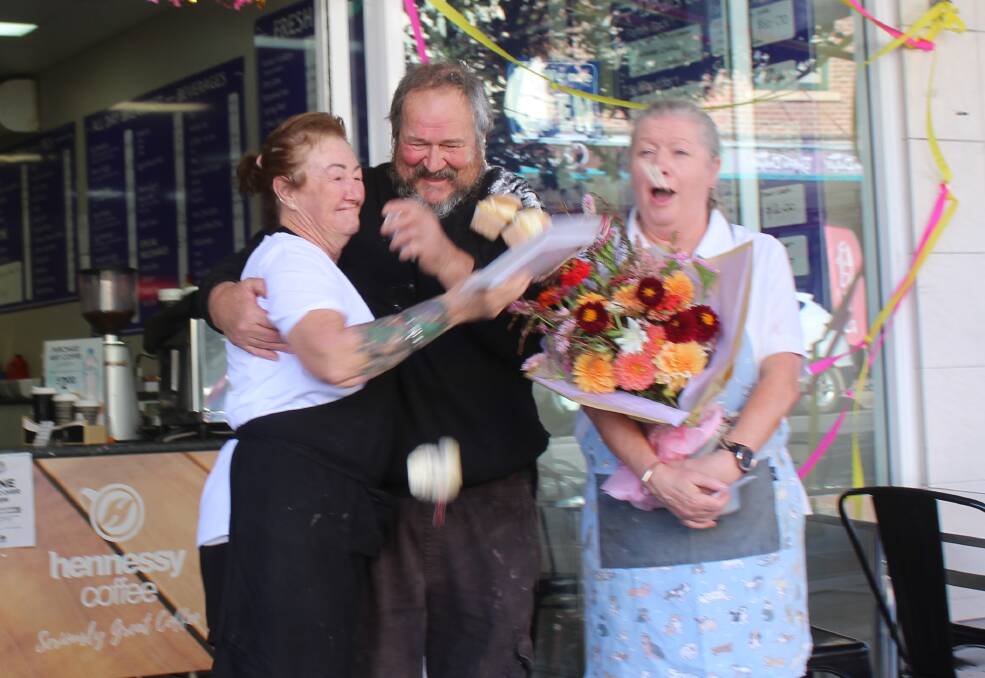 New owner Michelle Brown with previous owners Ken and Julie Woods. Ken decided he would go out with a bang today by starting one last cake throwing fight. Photos: Amandine Ahrens