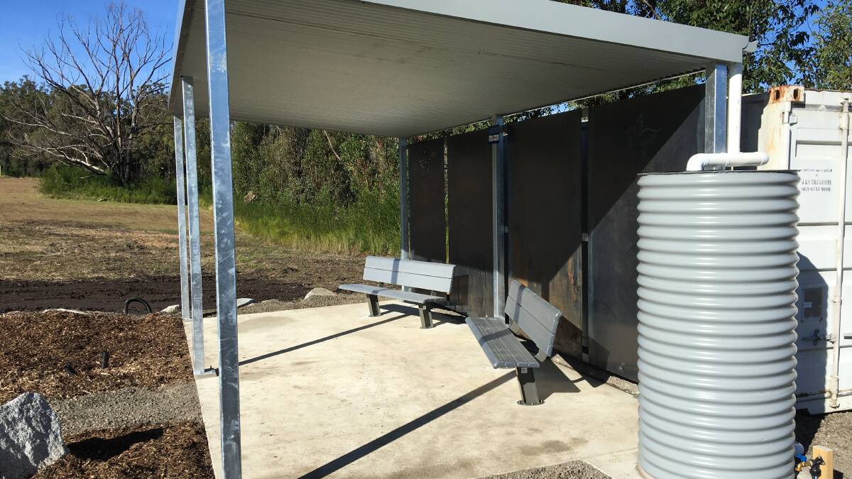 The completed pavilion showing the water tank and the shipping container that will be used for storing the groundskeeping equipment. Photo: Bega Valley Shire Council