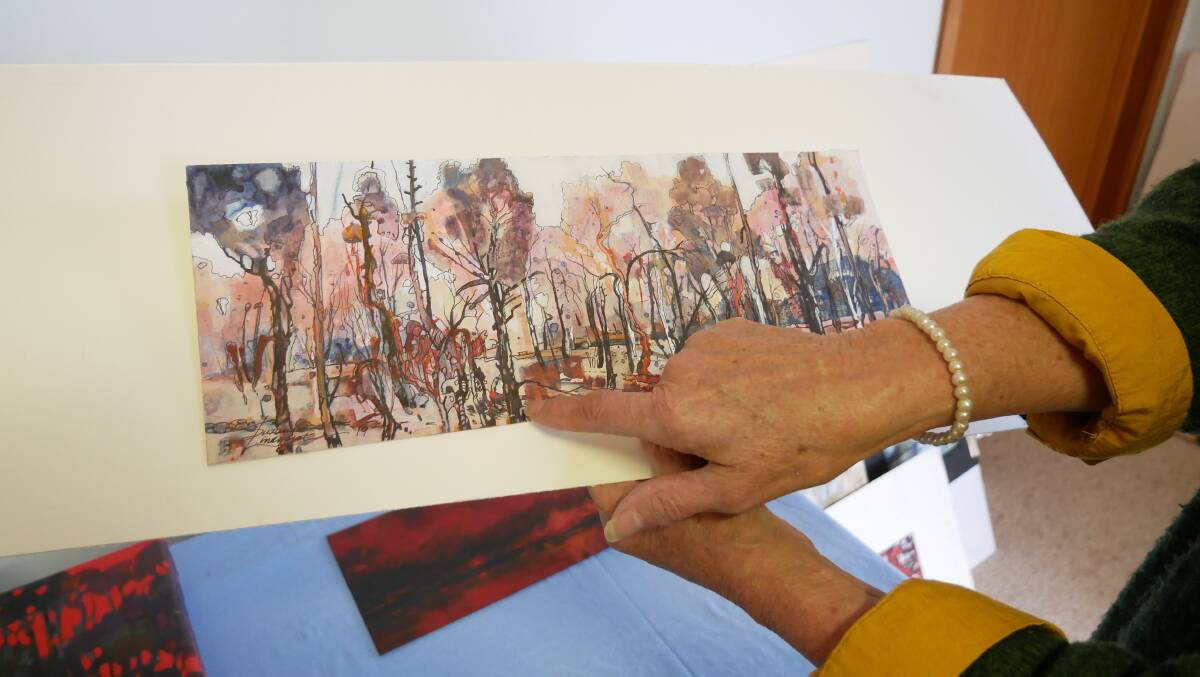 Ms Lindhorst uses ash and charcoal from the bushfires in the Bega Valley Shire in her paintings as well as ink to create pieces which reflect the trauma from seeing the bush on fire. 