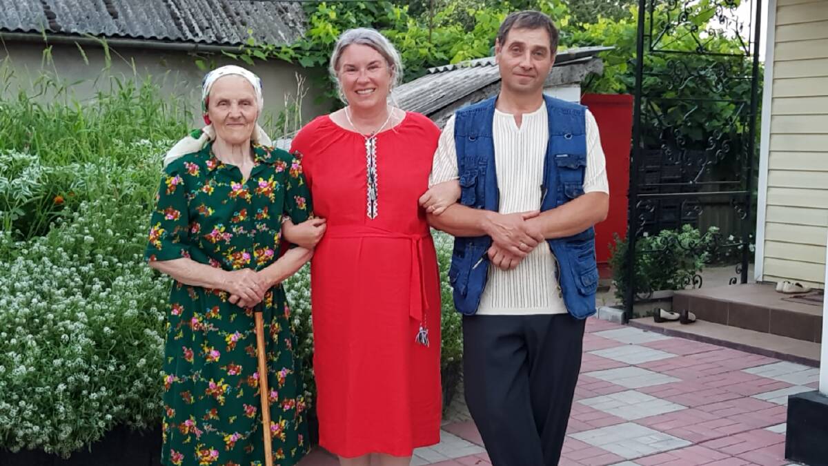 Tabitha Bilaniwskyj-Zarins with her grandmother's sister Vera and her uncle Kolya at the family's church in Ukraine. Photo: supplied