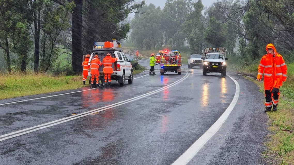 SES volunteers and the local fire brigade helping to remove trees and debris from roads. Photo: NSW SES Bega Valley Units.