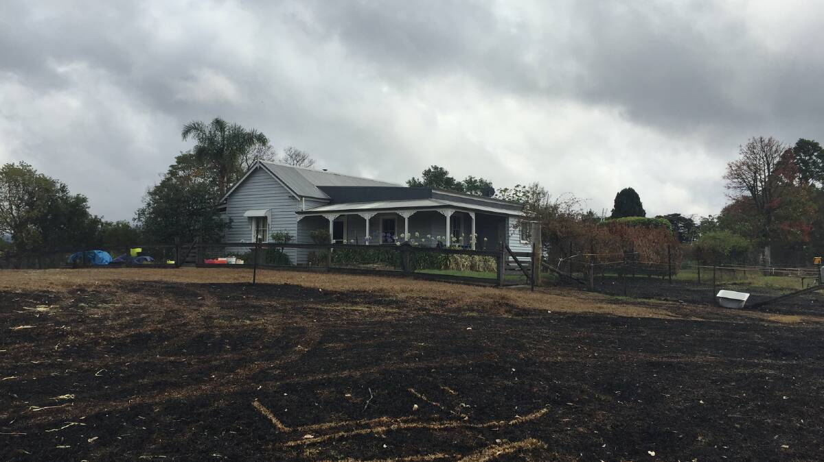 A photograph of Karyn Thompson's home after the bushfires. The fires had come within just two metres of her family's cottage. Picture: supplied