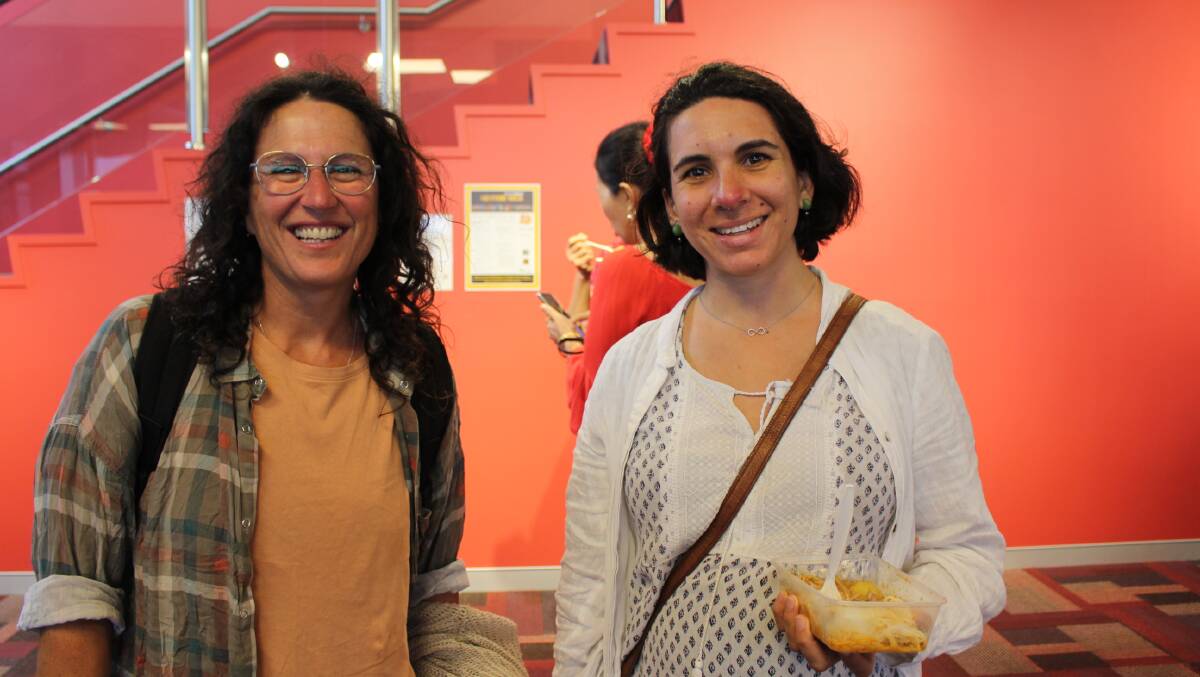 From left: Delia Jory and Guillermina Porporato enjoying the international food stalls. Both women having migrated from Europe to the Bega Valley. 