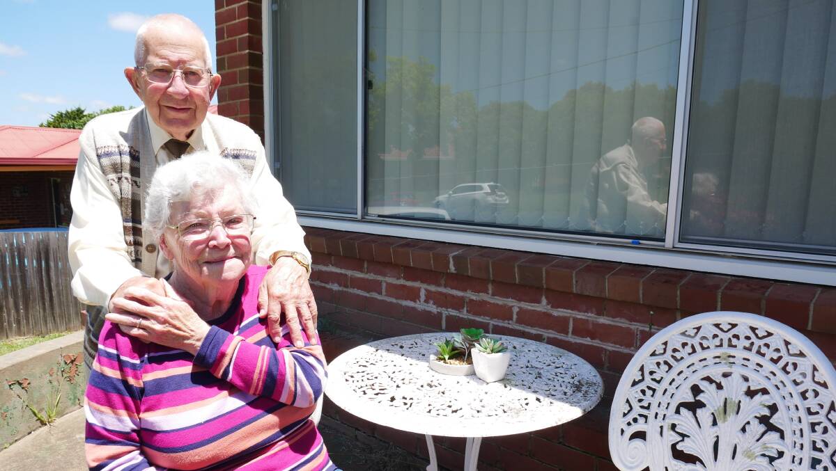 Graeme and Linda Bant out the front of their Bega home. The couple's advice for a happy and healthy marraige included always holding hands. Photo: Ellouise Bailey