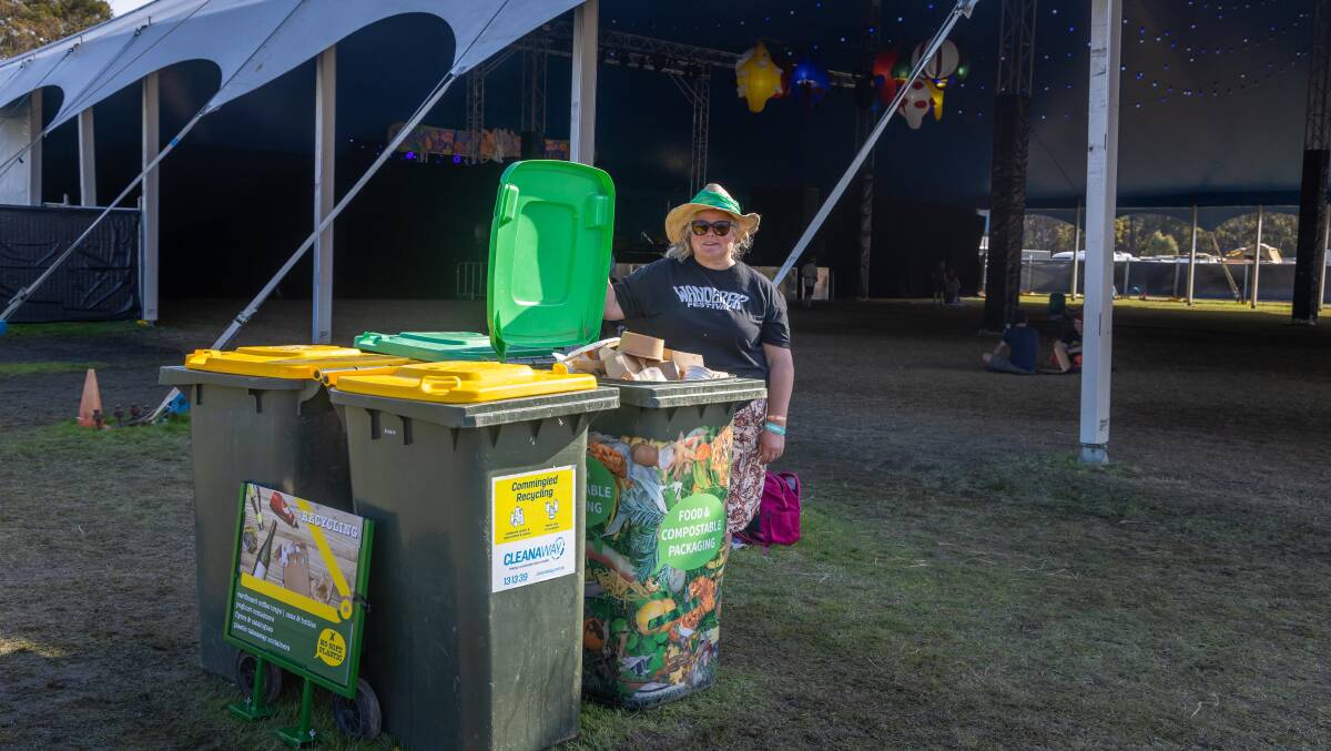 A volunteers directs patrons on which bin they should use for either their recyclable or compostable products at Wanderer Festival. Picture by David Rogers. 