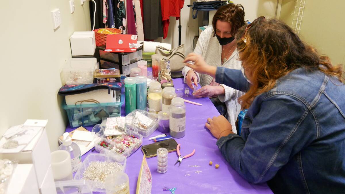 Cheryl and Helen in the process of creating jewellery to stock in the store or for Helen to take home. 