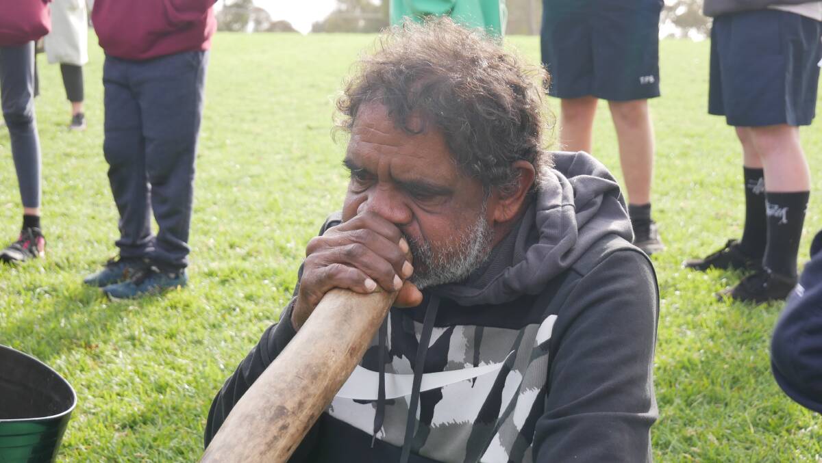 Uncle Lewis Campbell playing the didgeridoo at Tathra Public School for Reconciliation Week, 2022. Photo: Ellouise Bailey