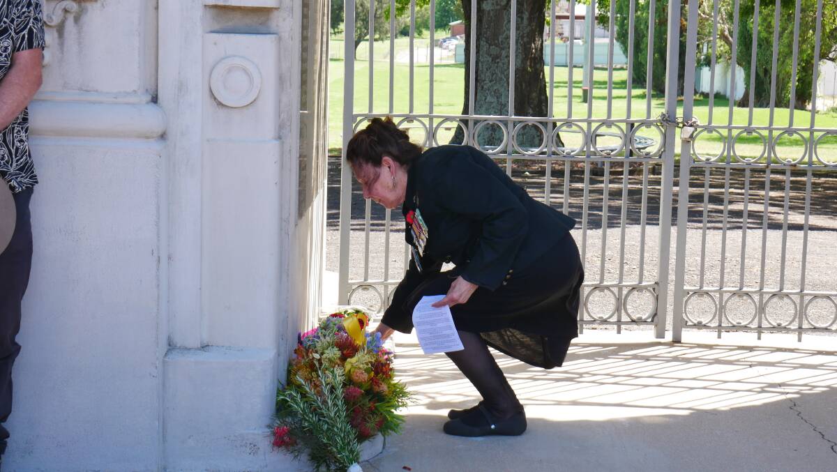 Marion Brunning lays a wreath at the memorial gates. Picture: Ellouise Bailey