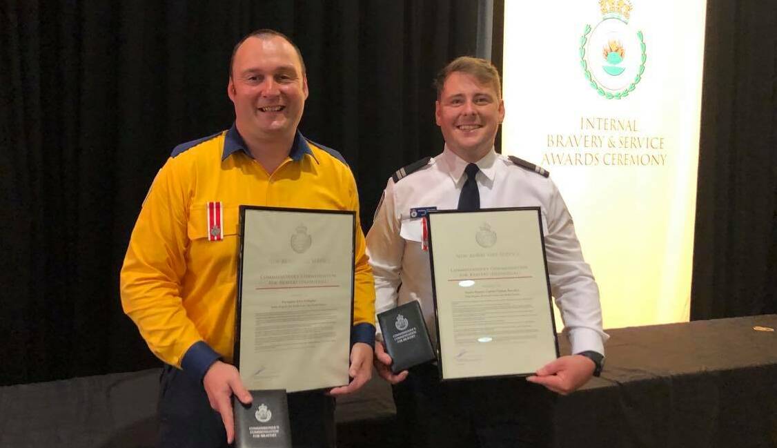 Firefighter John Gallagher from the Tathra Brigade, and senior deputy captain Nathan Barnden with their RFS bravery commendations. Picture: supplied 