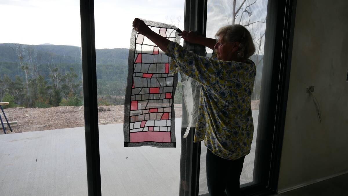 One of the pieces she created after the NYE Black Summer bushfire that was hand stitched using fabric and ink. "That's the day the sun didn't rise. You know the one," she said.
