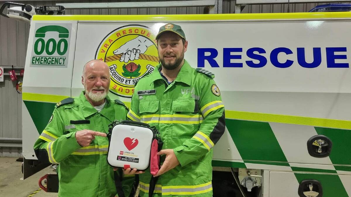 Bega VRA member Kevin Young with Captain Zac Willis holding the back-up defibrillation machine thanks to a funding grant from IMB Bank Community Foundation. Photo: supplied
