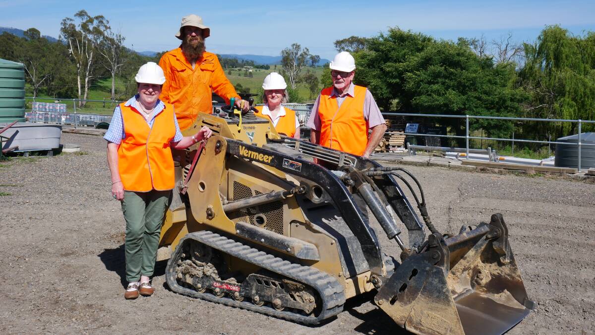 Ground moving works start at the site on the north side of the Cobargo Co-op on December 15 (from left) Co-op chairperson June Tarlinton, local concreter Josh Ventura, secretary-treasurer of the Cobargo Quaama Business Recovery Group Narelle Cooper, and Co-op director and project manager John Walters. Photo: Ellouise Bailey 