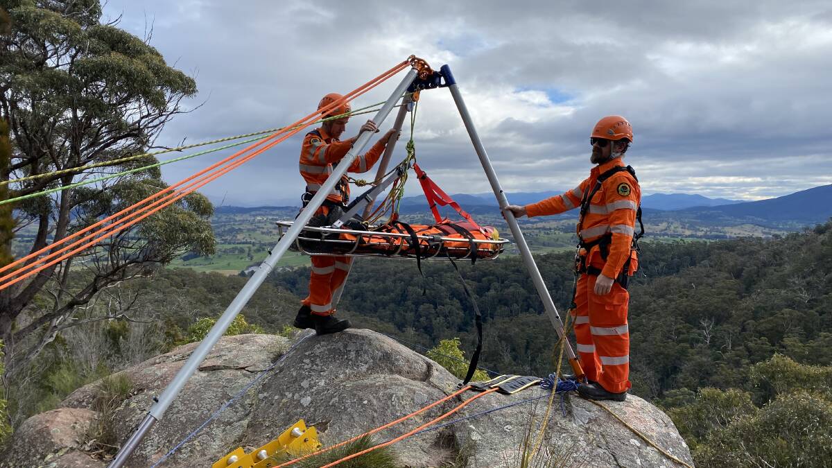 The Bega Volunteer Rescue Association and Bega State Emergency Service crews working together on training on Saturday, July 9. Here crews are learning how to do vertical rescues using a highly adaptable device called a Vortex Multipod. Photo: supplied