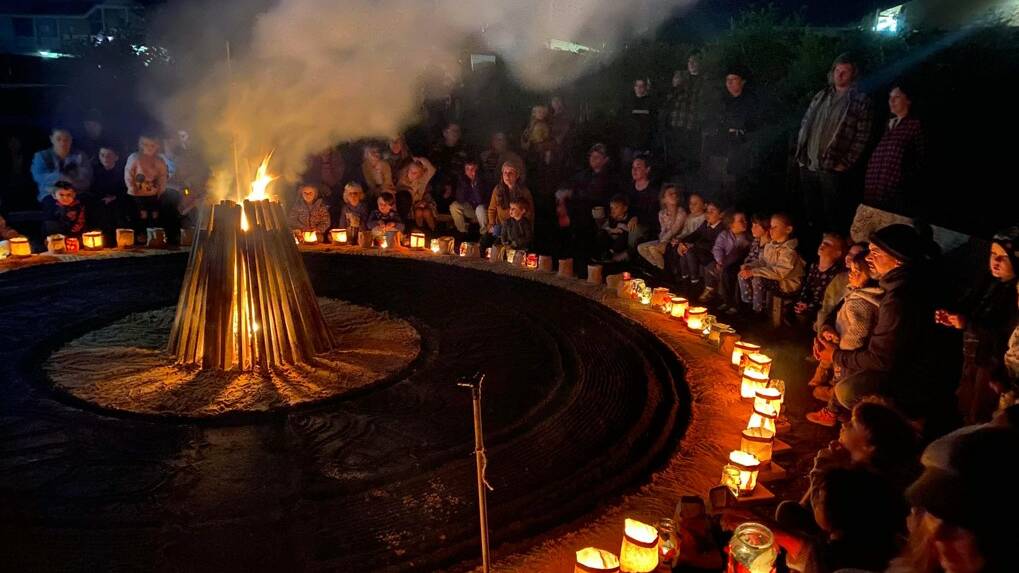 The fire circle was put together by Indigenous artist Cheryl Davidson who helped put together the sand mandala, local TV personality Paul West, children from the preschool, and students from Narooma High School. Photo: supplied
