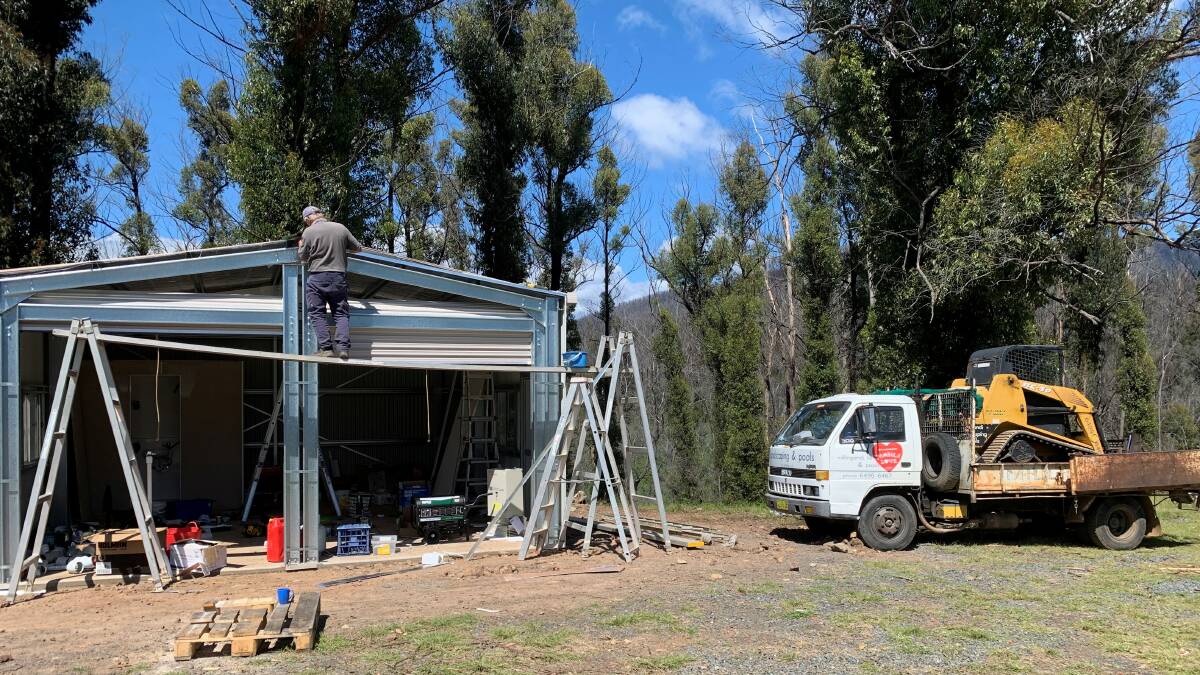 Shed with water tank and bathroom being installed on a bushfire impacted property. Picture: supplied 