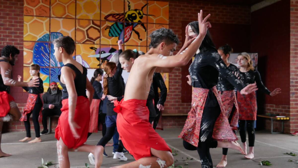 The students performing a dance about the Willie Wagtail at Bega High School for the grand opening event for their bush tucker garden and art installatoons project. Photos: Ellouise Bailey