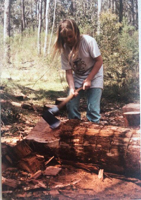 Ailsa chopping wood at her family home in Tantawanglo. Picture: supplied. 