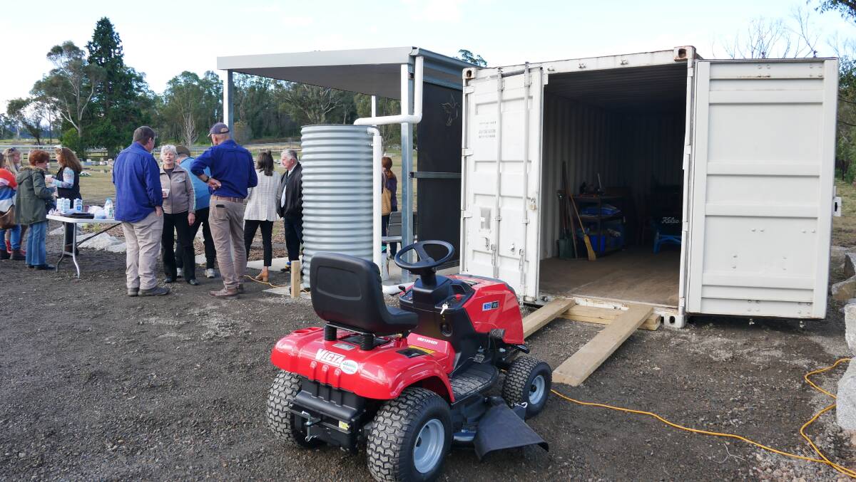 Merimbula Rotary donated a ride on mover, wheelbarrow and whipper snipper which will now be stored in the shipping container at the site. 
