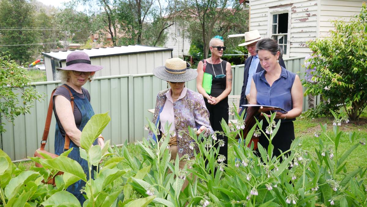 Sandra Taylor, Ms Hurley, and Shona Taranto discuss the plants in the Cobargo communtiy garden. Photo: Ellouise Bailey