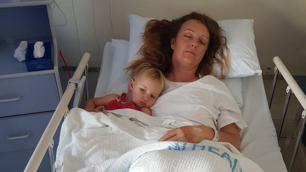 Sally Lloyd with daughter Ruby while in the hospital for her brain surgery. Photo: supplied 