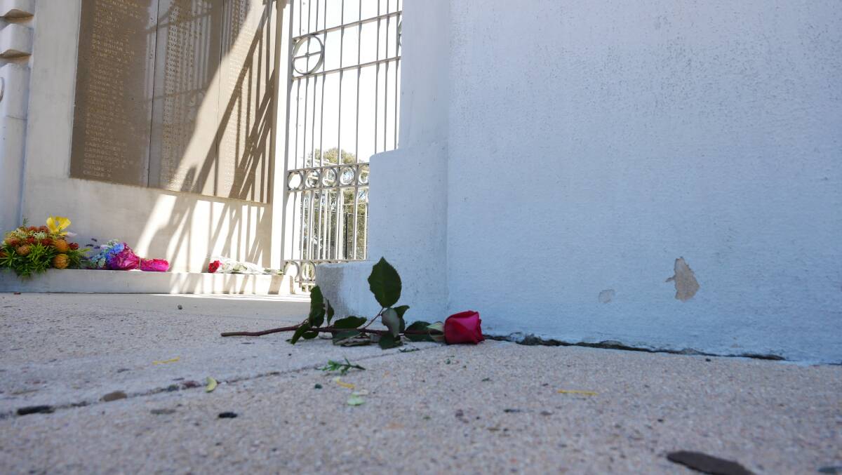 A single red rose left a the memorial gate in Bega. Picture: Ellouise Bailey