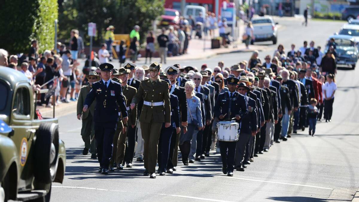 Veterans, their families and school students marching in the 2021 Anzac Day march in Merimbula.