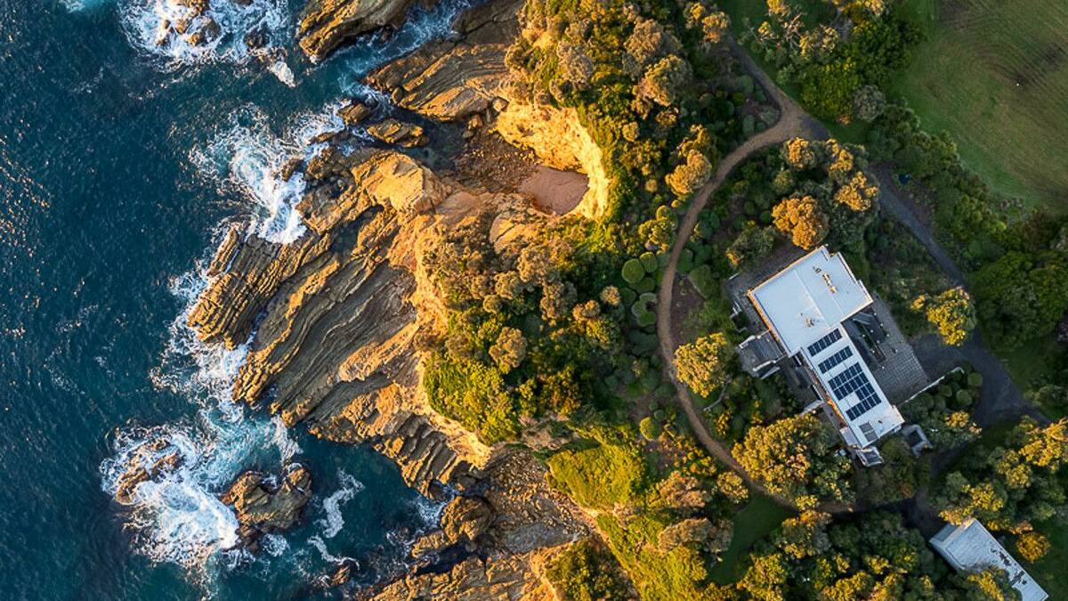 A South Coast home with beach access and clifftop frontage has been listed for sale. Picture: Marshall and Tacheci Real Estate