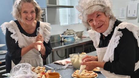 Careena and June dressed as maids to serve during the 90th birthday celebrations.
Picture: supplied
