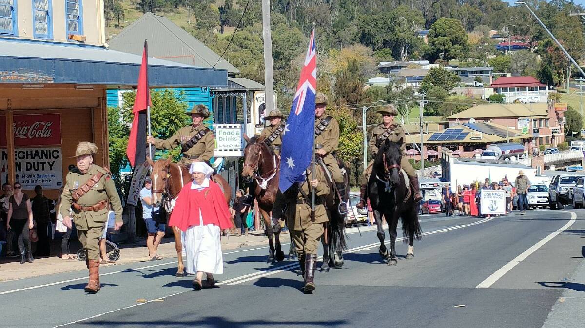 Leading the march with the Light House troop was nurse Maree Blair. To her left is Jan White (face concealed by flag), and to her right Light House Troop Commander Warren Davis. On the horses are Doug Blair, Lyle Blair, Nina Balas and Pauline Blair. Picture by Narelle Churchill.