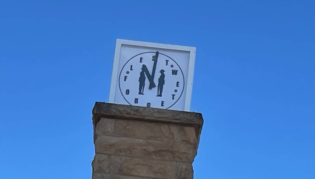 Instead of numbers on the clock face are the words Lest we forget. Narooma RSL sub-Branch president Paul Naylor said it reminded him so much of the original clock that was installed in 1975. Picture by Marion Williams