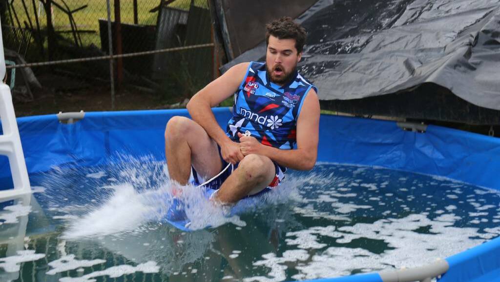 In 2019 Merimbula Diggers captain Daniel Worden was the first one down the Ice Slide as part of the combined Diggers-Lions Footy 2 Fight MND fundraiser. Photo: file