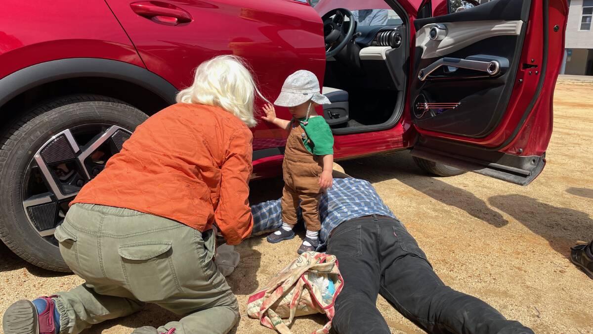 Members of the public were interested in seeing how much clearance the EVs had and looking at the minimal engines. David Neyle said there are several charging stations in Bermagui at holiday parks, motels and Fishermen's Wharf. Picture by Marion Williams