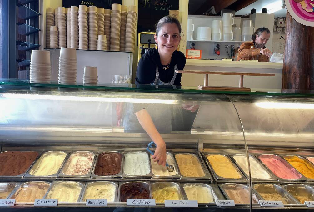 Francesca Michielin serving in the Bermagui Gelati Clinic while Alberto Cementon makes gelati at the rear of the shop. Picture by Marion Williams