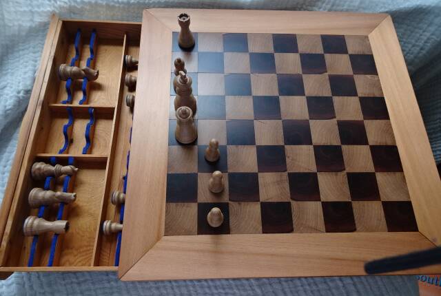 This chess set has a drawer under the chess board to hold the pieces, all of which were turned and carved. Picture supplied.