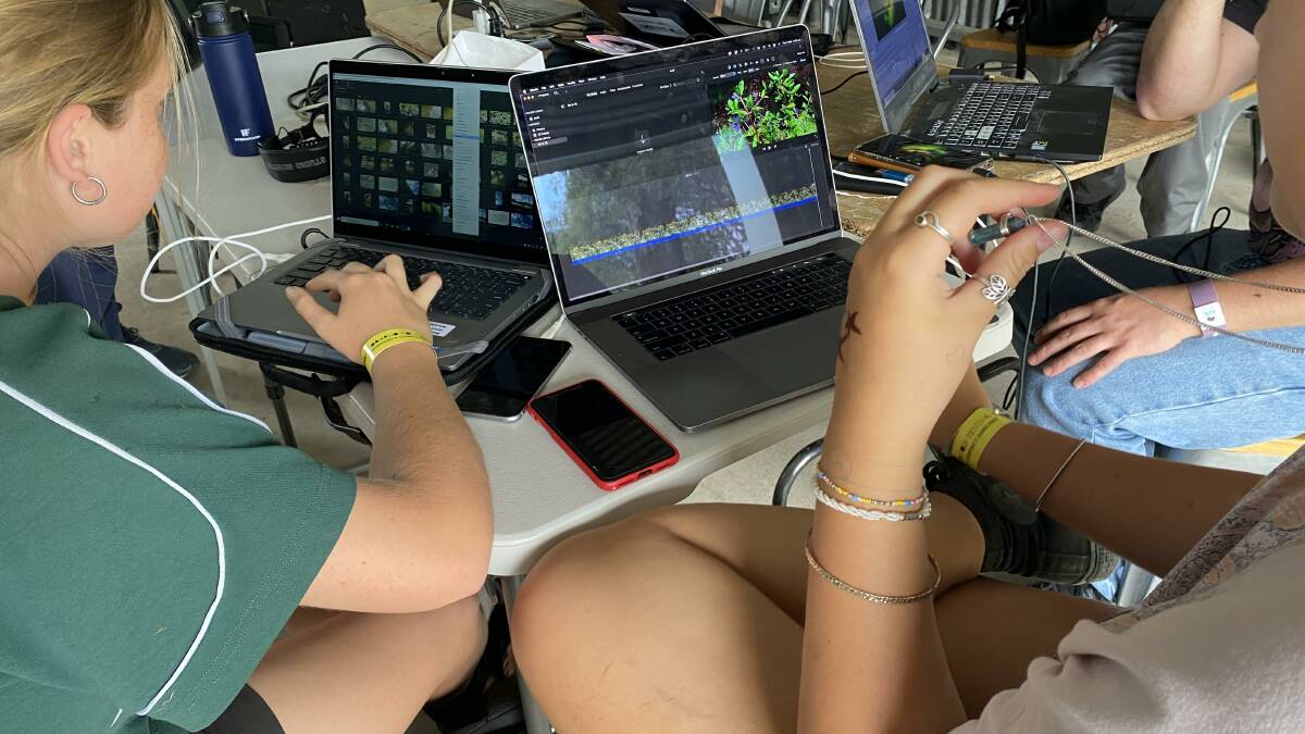Students editing their videos at Cobargo Folk Festival. Picture supplied