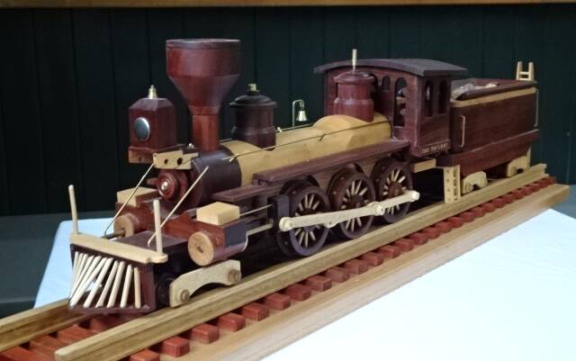 Each piece of this model locomotive is hand-made using various timbers to accentuate the moving parts. It won Best in Show and Peoples Choice in the 2021 Tilba Woodwork Exhibition. Picture supplied.