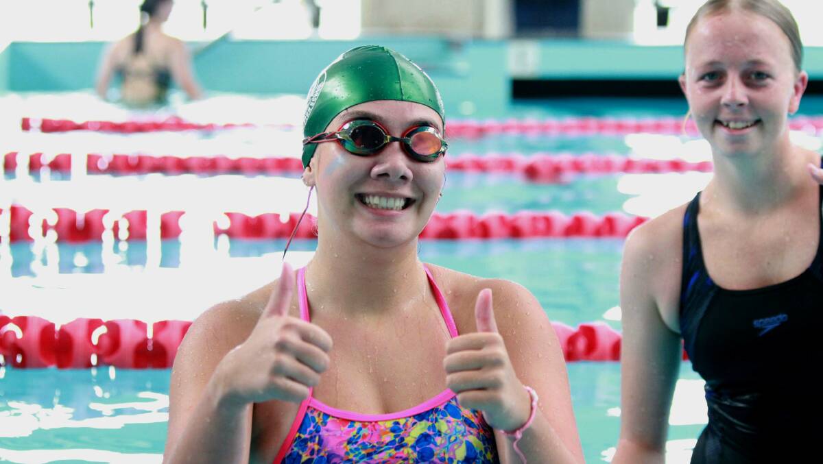 Sophie Potts and Kya Rixon could not keep the smiles off their faces at Narooma High School's swimming carnival. Picture supplied