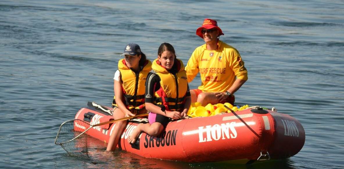 Ben Bate, pictured with his twin nieces, is duty officer at Narooma Surf Life Saving Club and has been volunteering with the club for 15 years. He was unable to attend the Surf Life Saving NSW Awards of Excellence on Saturday, August 26. File picture