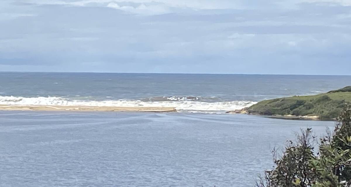 By 12.18pm Wallaga Lake was flowing more freely out to the ocean. Picture by Bill Southwood