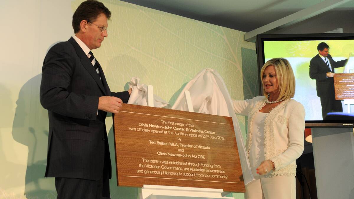 Olivia Newton-John and former Victorian Premier Ted Baillieu unveil a plaque at the Opening of the Olivia Newton John Cancer and Wellness Centre at the Austin Hospital in Melbourne on June 22, 2012. Photo: AAP