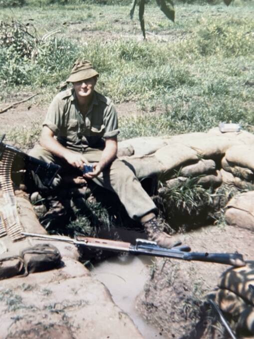 Ron cleaning his rifle, taken just hours before the accident. Photo supplied. 