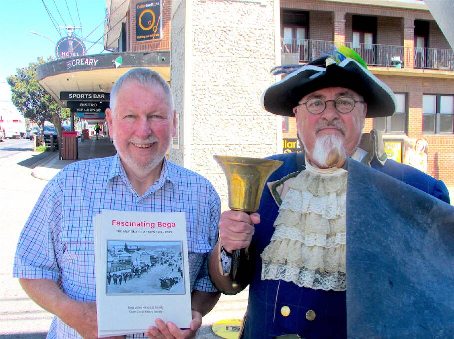 Peter Lacey, President of the South Coast History Society, with Alan Moyse, the Bega Town Crier, announcing the publication of 'Fascinating Bega: The Anatomy of a Town 1851 - 2023' at the clock tower in Bega. Picture supplied. 