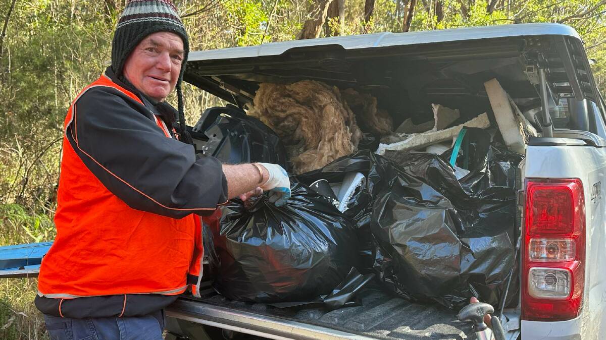 Bill Foxwell loading up rubbish for the tip. Picture supplied. 