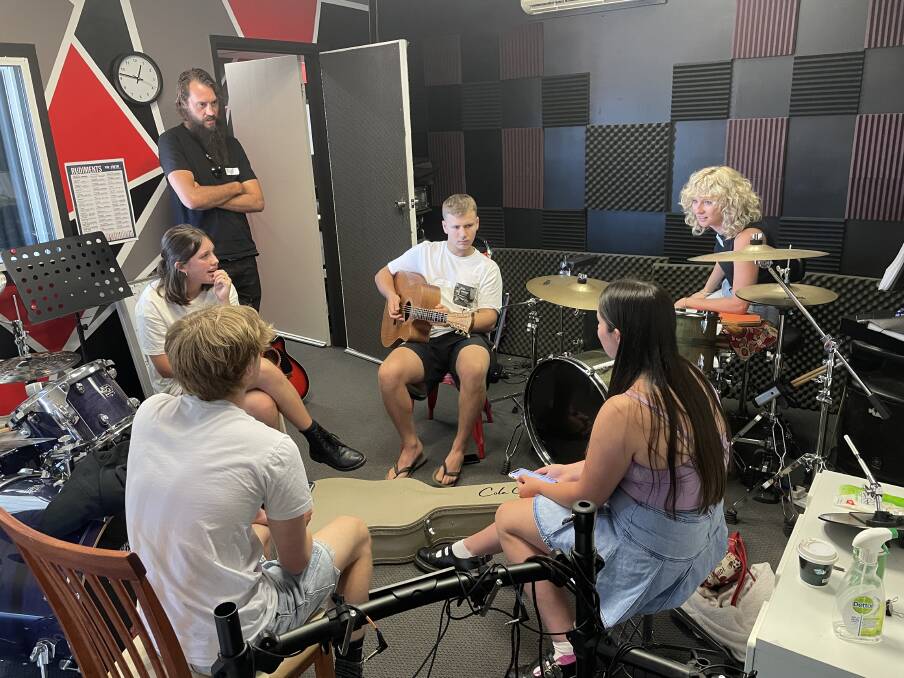 Luke on guitar with Shari, Jacob and Amelia each taking on the advice from Katie Wighton and Ricky Bloomfield. Picture by Sam Armes. 