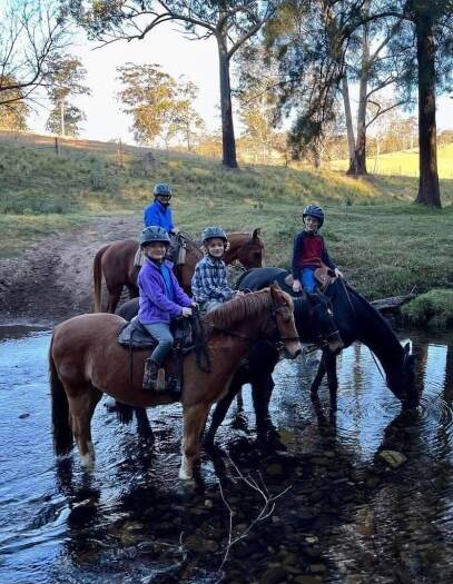 Jenny Shepheard (back) is pictured with her grandchildren Ethan (10), Toby (8) and Miranda (5) as they train for the Currowan Endurance Ride. Picture supplied