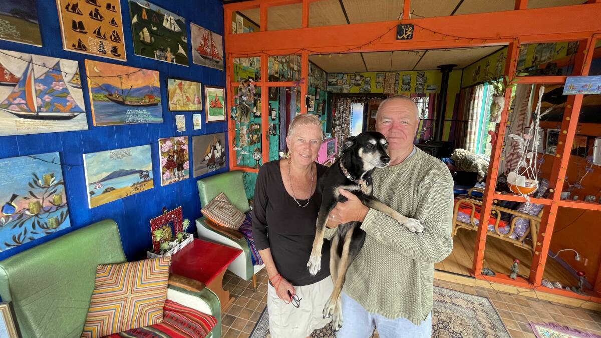 Robyn and John Fuller wearing muted tones so they stand out, with their Mexican street dog Perlita. Picture by James Parker