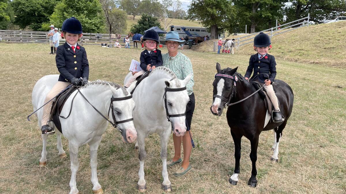 Hallie, Lexie and Lacey Cowdroy with mum Kristen Cowdroy from Cobargo on their horses Calvin, Jackson and Bubble during 2023 Candelo Show. File picture