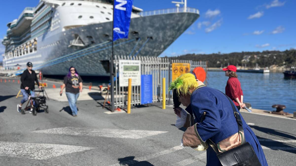 Town crier Alan Moyse bows to welcome passengers from the Brilliance of the Seas. Picture by James Parker