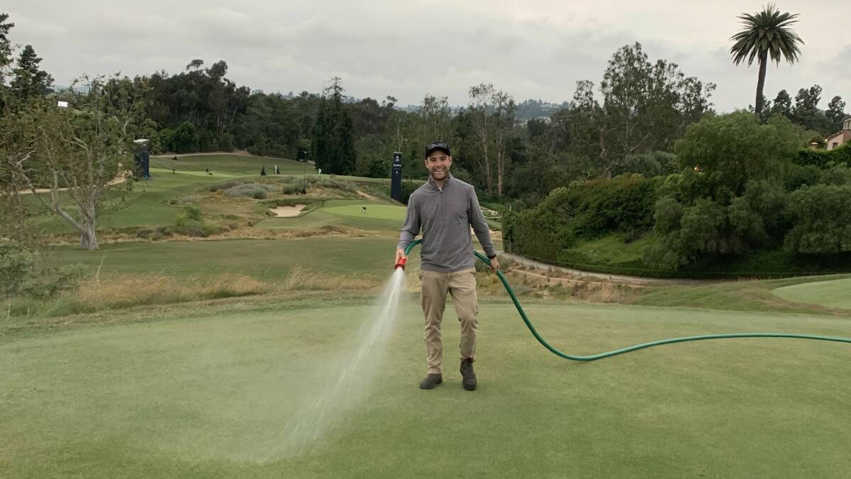 Tura Beach Country Club superintendent Brad Foster at The US Open hand watering the course to help with its consistency and its most prestigious quality. Picture supplied