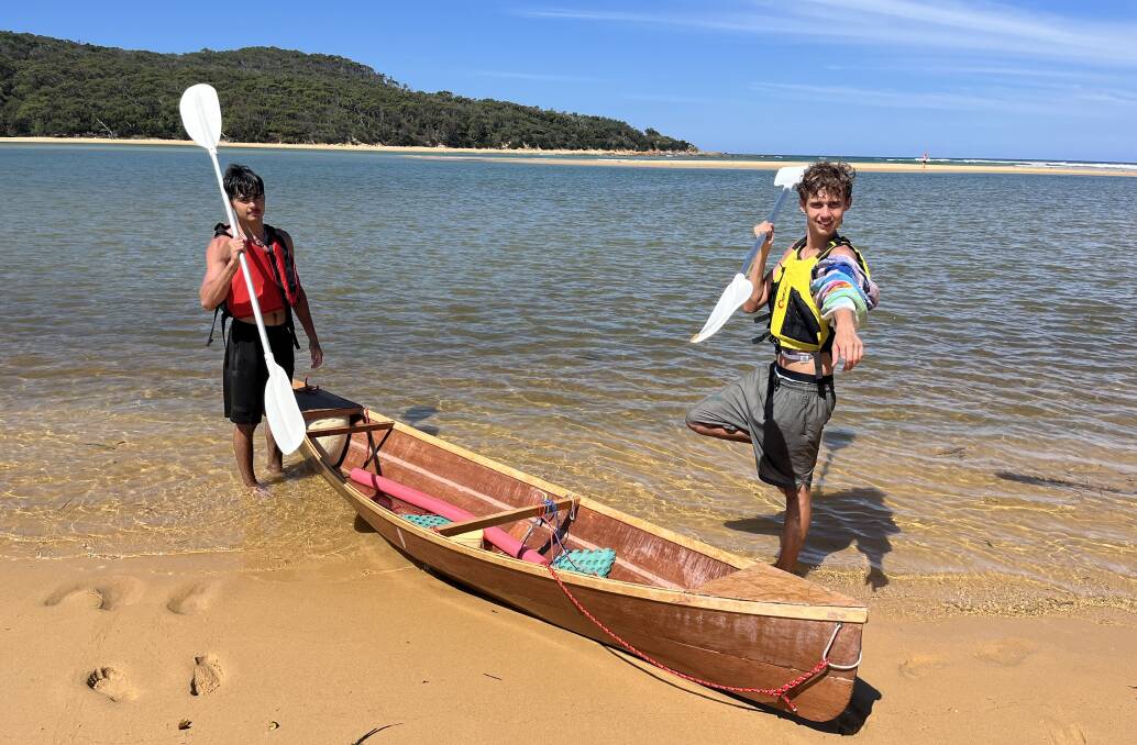 Djiringanj-Yuin teenager Kieran, and Kamilaroi-Kurnai-Djiringanj teenager Makai, proudly stand alongside the canoe they built over three days.